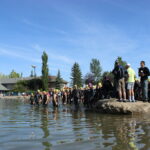 A summer morning at a south Calgary lake community beach and clubhouse
