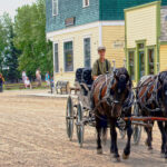 A horse-drawn carriage on the main street of Heritage Park Historical Village