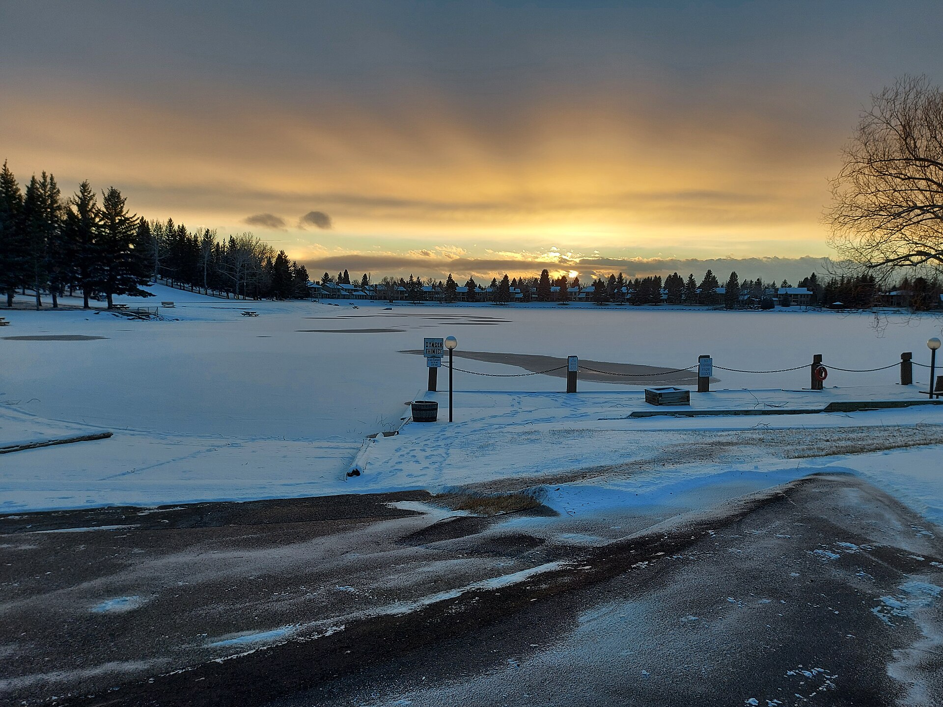 Sunset over a snow-covered Lake Midnapore in south Calgary